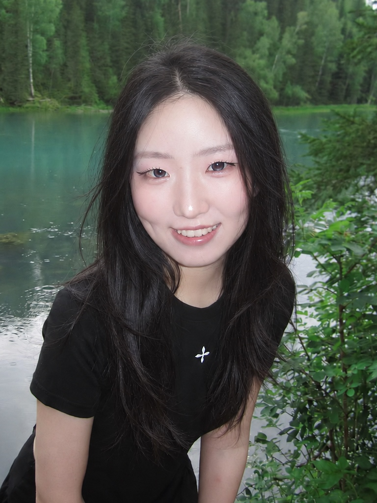 Xinrong (Claire) Zhou by a lake